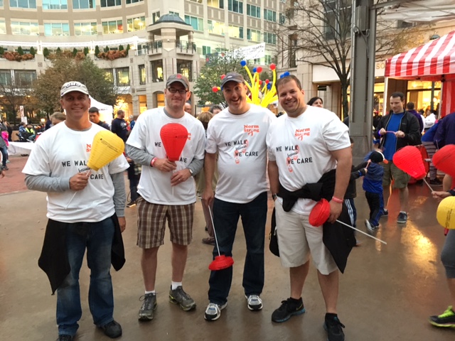 Employees at a community fundraising event at a town center