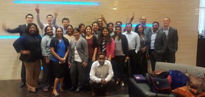 Gunnison employees in group photo of diverse races and cultures.