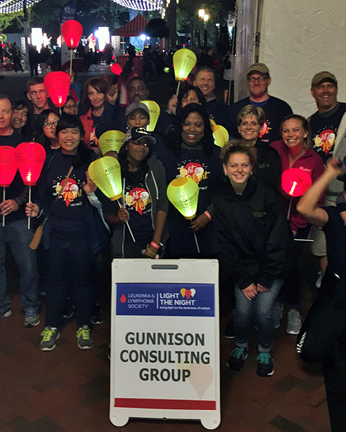 Employees at a community fundraising event at a town center at the end of the event